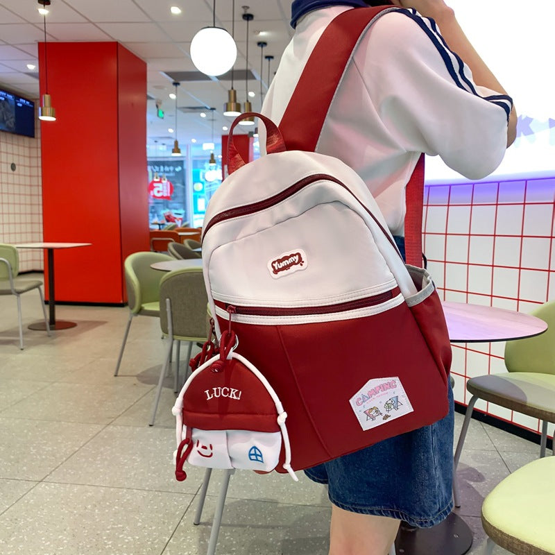 College student schoolbag, junior high school student backpack, women's summer Korean style fashion, large capacity and light high school travel backpack tide