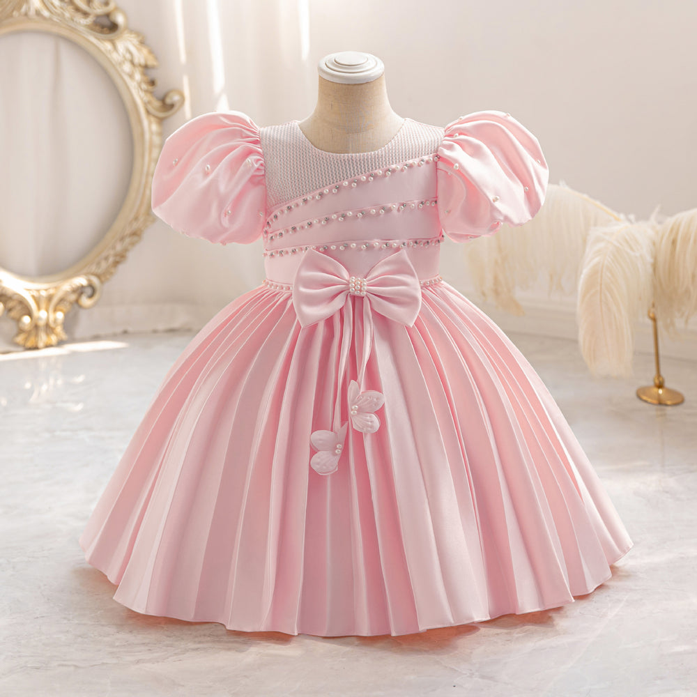 Ready-to-ship wholesale toddler evening gowns, fabric bows, princess dresses, piano recital dresses, and baby dresses