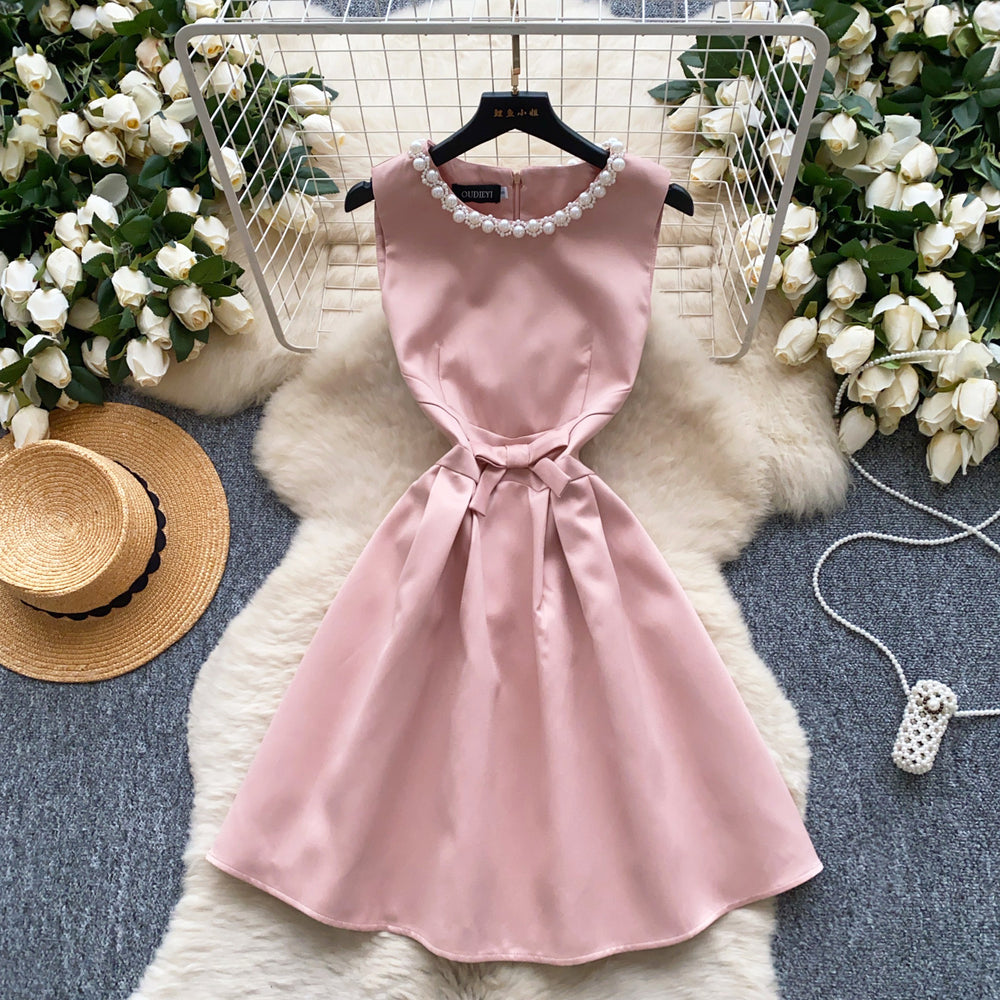 High-end, understated luxury beaded round neck sleeveless dress for women. perfect for summer, this french-inspired dress features a cinched waist, a-line silhouette, and a flattering, voluminous skirt. ideal as an elegant evening gown or special occasion