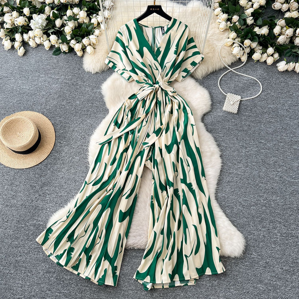 Fashion ins style vacation beach pants women's new style light mature niche stylev neck short sleeve strap looseprinting jumpsuit