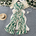Fashion ins style vacation beach pants women's new style light mature niche stylev neck short sleeve strap looseprinting jumpsuit