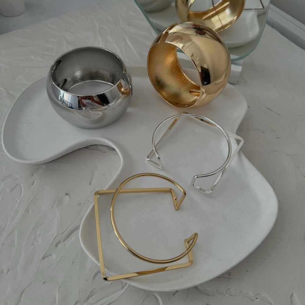 Wholesale alloy bracelets: european & american cross-border fashion jewelry - minimalist bangles with unique, bold geometric designs for women