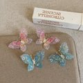 High-end, ethereal gradient 3d butterfly stud earrings for women. unique, niche design, fashionable, elegant, and versatile