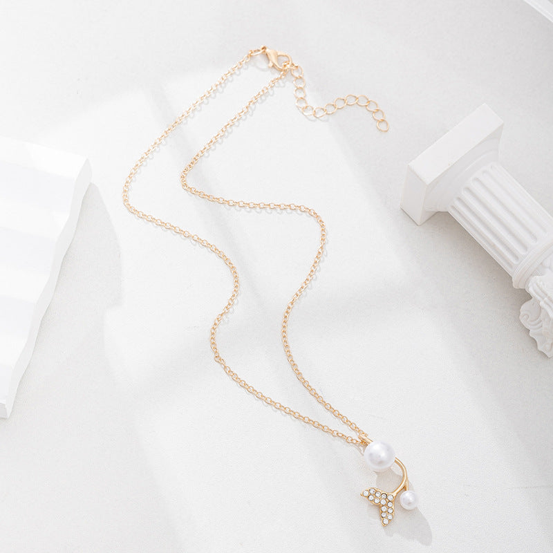 European and american cross-border e-commerce new jewelry: autumn/winter fashion pearl cross pendant versatile diamond-encrusted fishtail necklace for women