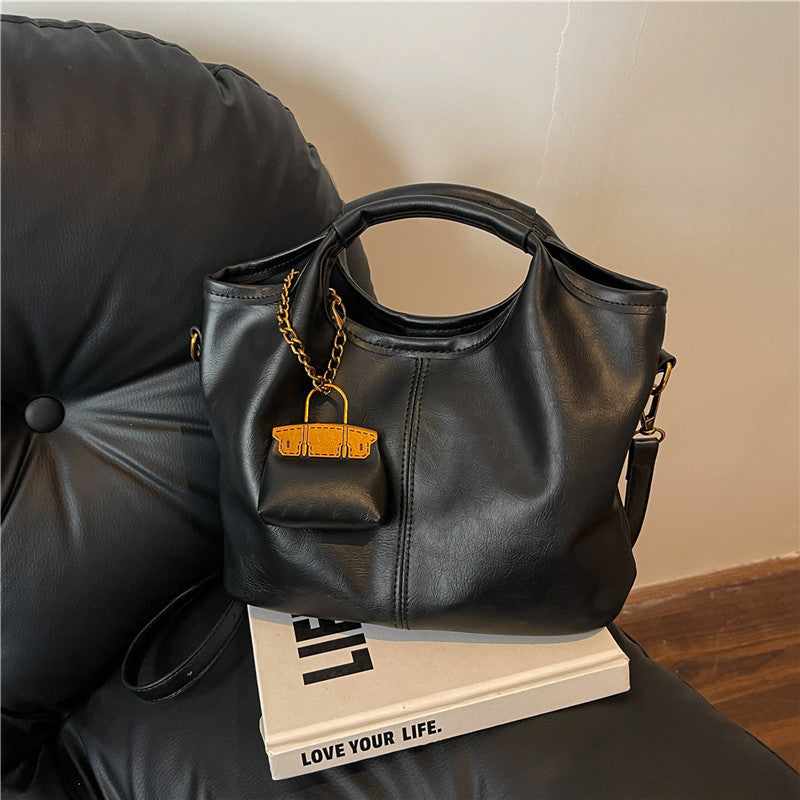 Retro niche handbag women's autumn and winter new high-end commuting large-capacity shoulder messenger bag mother and child bag