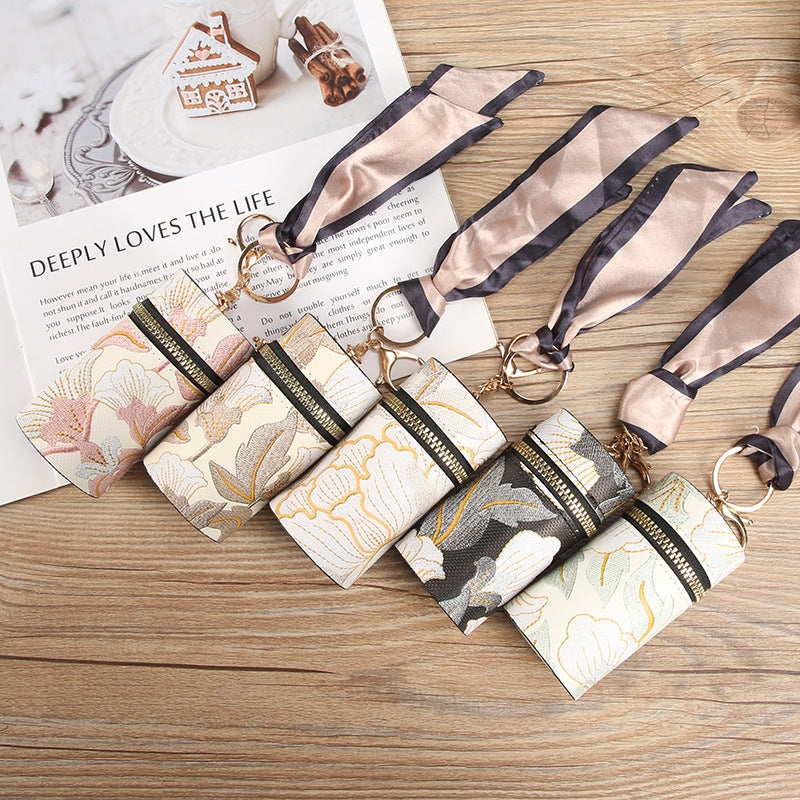 Manufacturer spot Guofeng fashion bag change bag small clear flower portable earphone port red envelope car key pendant