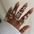 Vintage-inspired floral ring set - 13 piece collection. unique, high-end, and versatile. features faux pearls and diamond accents