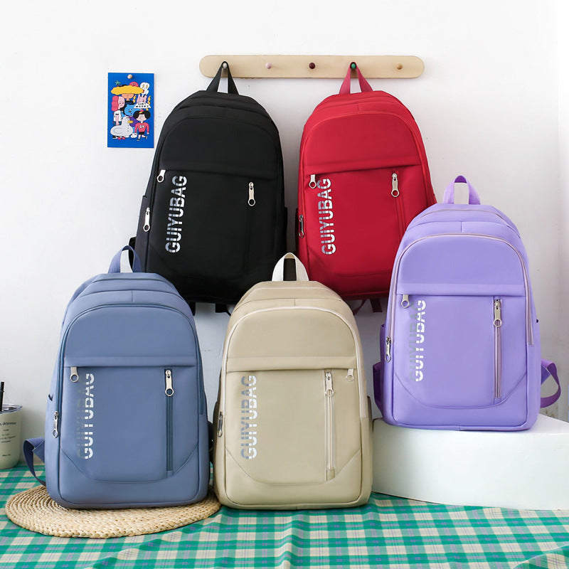 Primary and secondary school students schoolbag large-capacity bag simple solid color versatile backpack new fashion trend backpack