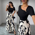 women's v-neck a-line dress with cinched waist, black and white abstract print, and metal buckle detail – elegant and versatile