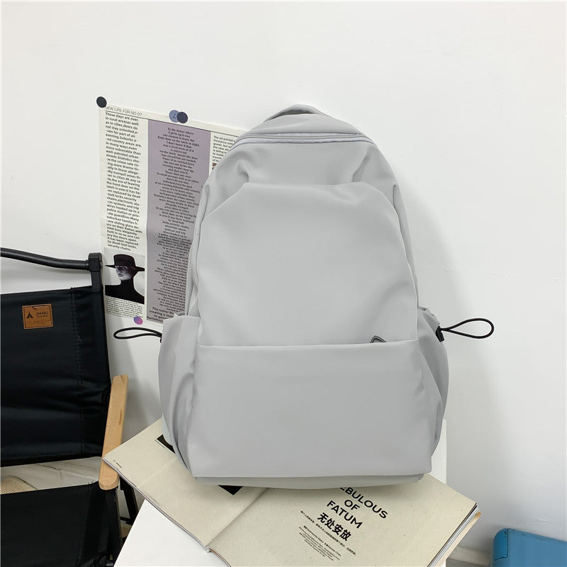 Campus Japanese backpack versatile male and female junior high school college student schoolbag solid color casual large capacity travel backpack