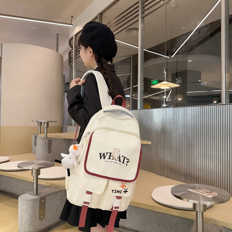 School bag for female junior high school students, large-capacity Japanese backpack for primary school students, third to ninth grades to reduce the burden and protect the spine, fashionable backpack
