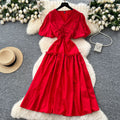 French-inspired, niche v-neck dress with ruched waist, puff sleeves, and a flowy, a-line silhouette. perfect for a slimming and elegant summer look