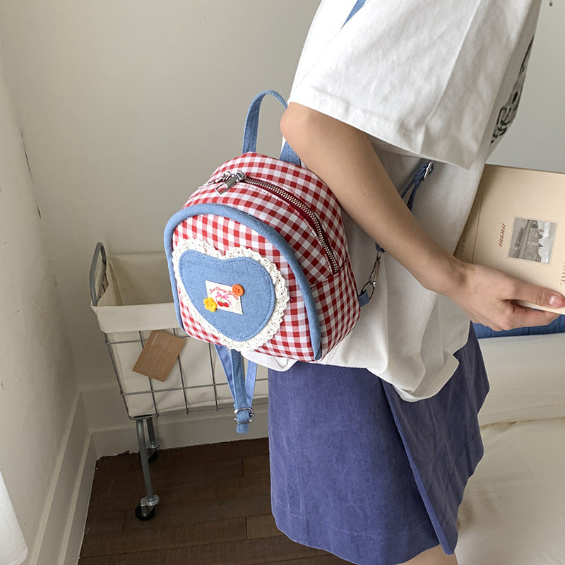 Outer order super fire plaid women's backpack 2025 new spring and summer contrasting color versatile backpack mini schoolbag
