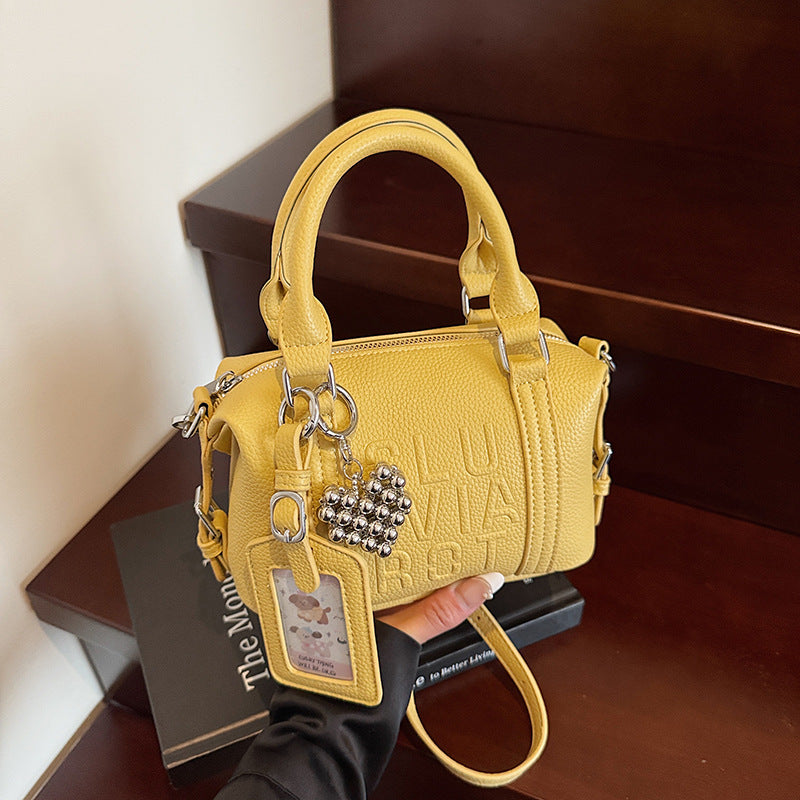 Fashion niche high-end sense embossed letter pillow bag 2025 new summer versatile color casual messenger bag