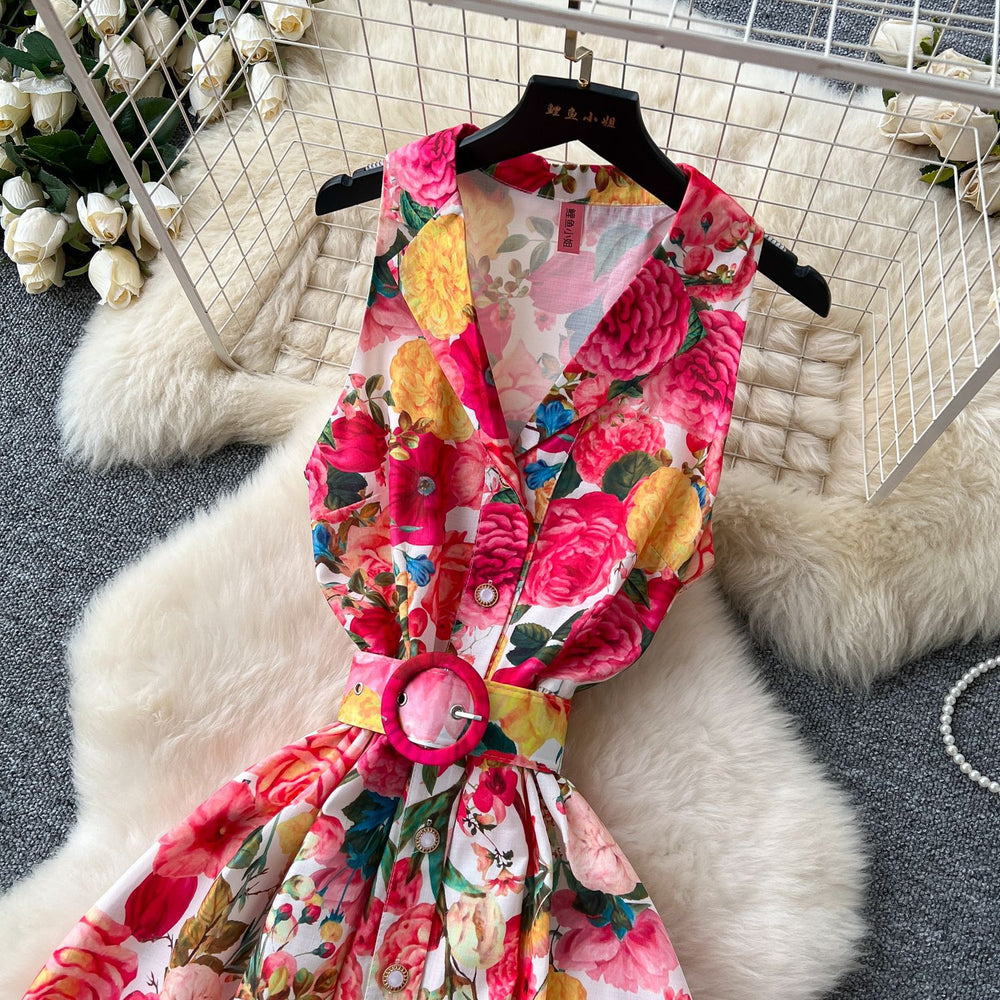 early spring new arrival: women's unique & elegant sleeveless midi dress with notch collar, cinched waist, single-breasted button detail, and flowy printed skirt