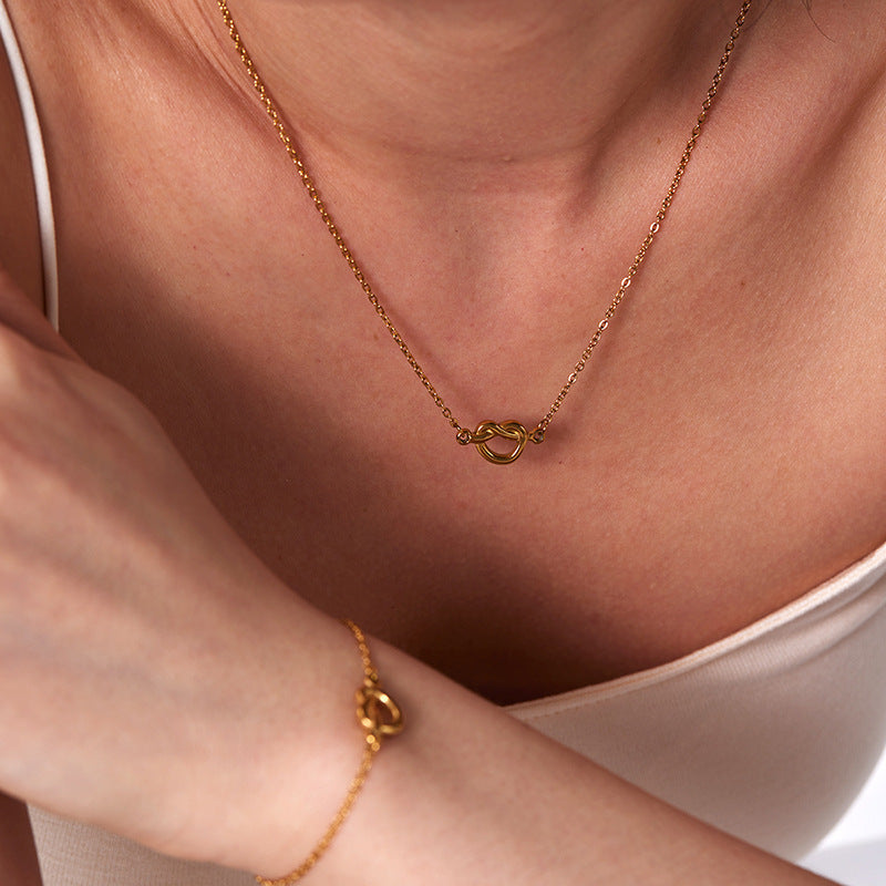 European and american fashion ins minimalist 18k gold plated knotted necklace titanium steel short rope cross pendant four-piece jewelry set