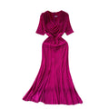Elegant and alluring, this high-end, figure-hugging, mid-length mermaid gown features a plunging neckline, short sleeves, hot-fix rhinestone embellishments, and a daring slit. perfect for the sophisticated woman