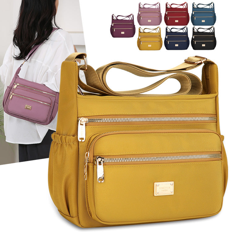 Women's bags are fashionable and simple, large-capacity messenger bags, multi-layer storage, travel shoulder bags, going out for commuting, middle-aged mother bags.