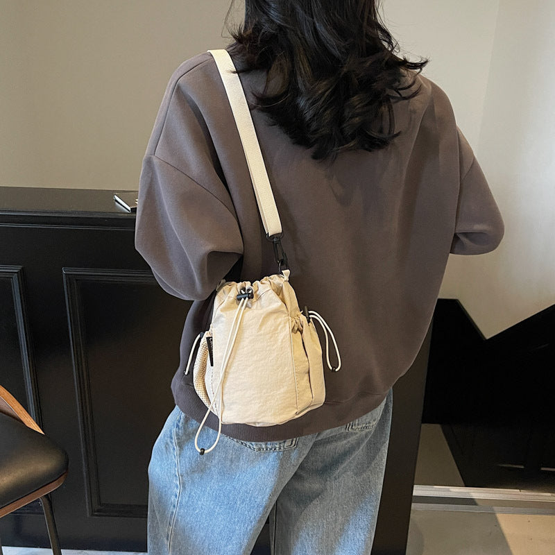New drawstring bundle hand carry bucket bag  simple casual versatile shoulder bag outdoor commuter messenger women's bag