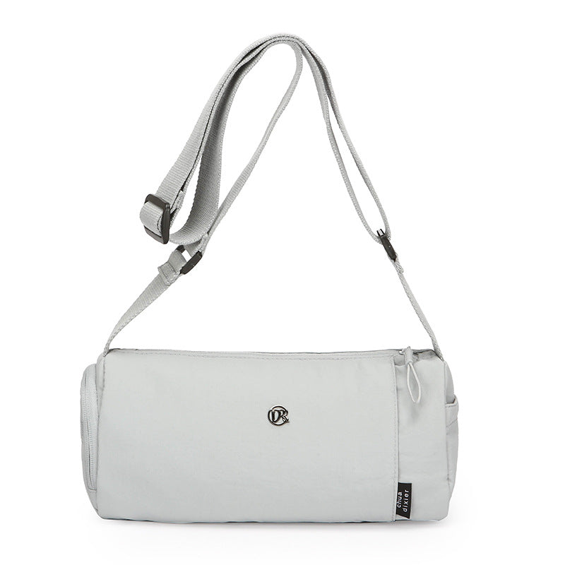 Simple Japanese shoulder bag women's nylon anti-splashing cylinder pillow bag trendy cool messenger bag commuter portable handbag