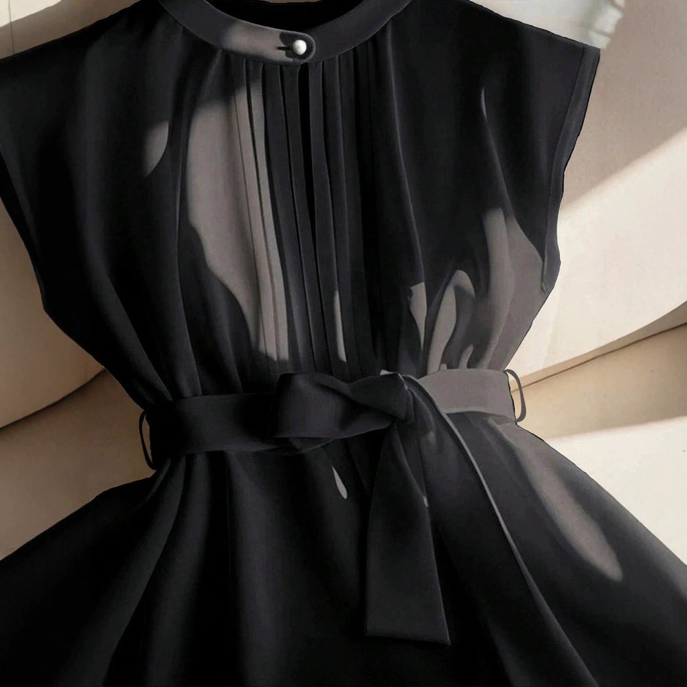 plus size french sleeveless top with stand collar, single button, chest pleat, tie waist, semi-sheer and flowy