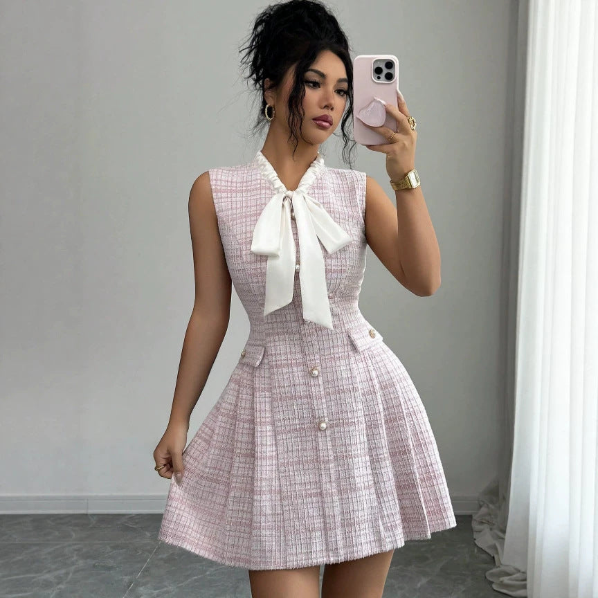 european and american new style pink sleeveless chanel-inspired dress with bow, stand collar, pearl buttons, cinched waist, and a-line silhouette