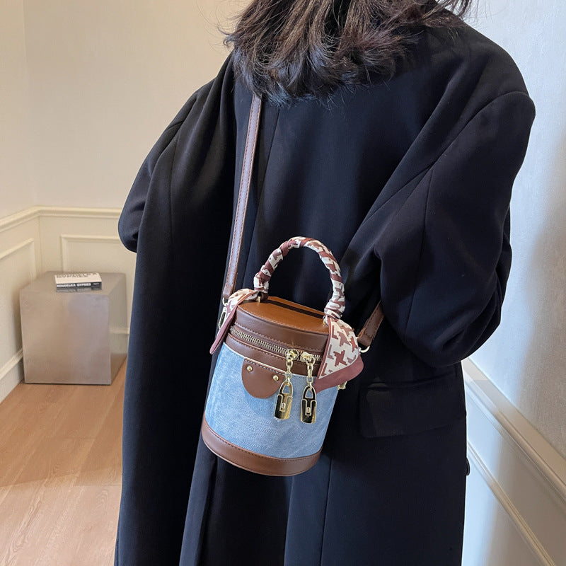 Retro contrasting color bucket bag women's 2025 new niche design portable cylinder bag versatile texture shoulder messenger bag