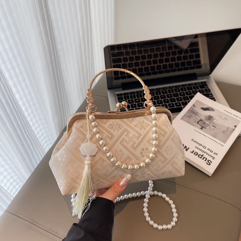 Cross-border new Chinese style national style hand bag women's summer 2025 new niche messenger bag Korean version popular mouth gold bag