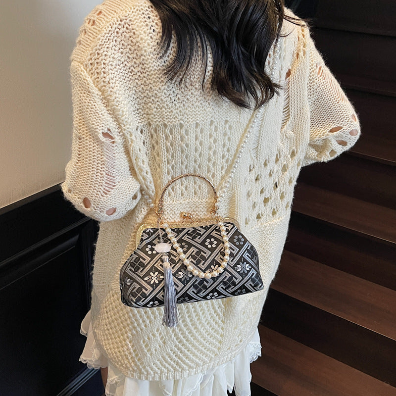 Cross-border new Chinese style national style hand bag women's summer 2025 new niche messenger bag Korean version popular mouth gold bag