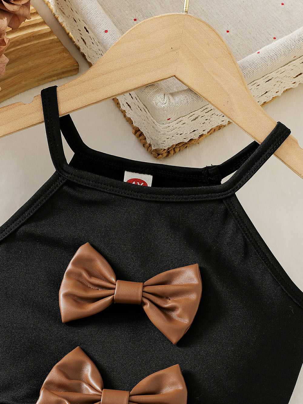 cross-border girls' fashion bowknot solid color camisole + pu leather skirt two-piece set