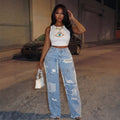 Women's light blue distressed wide-leg jeans with ripped hems, high waist, and frayed details - new autumn collection