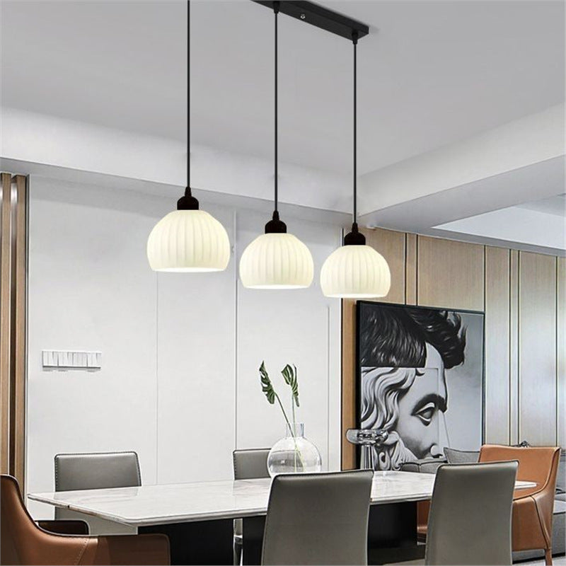 Modern minimalist dining room pendant light - creamy new style  - trending online - perfect for dining tables, bedrooms, studies, and bar counters - glass pendant lamp