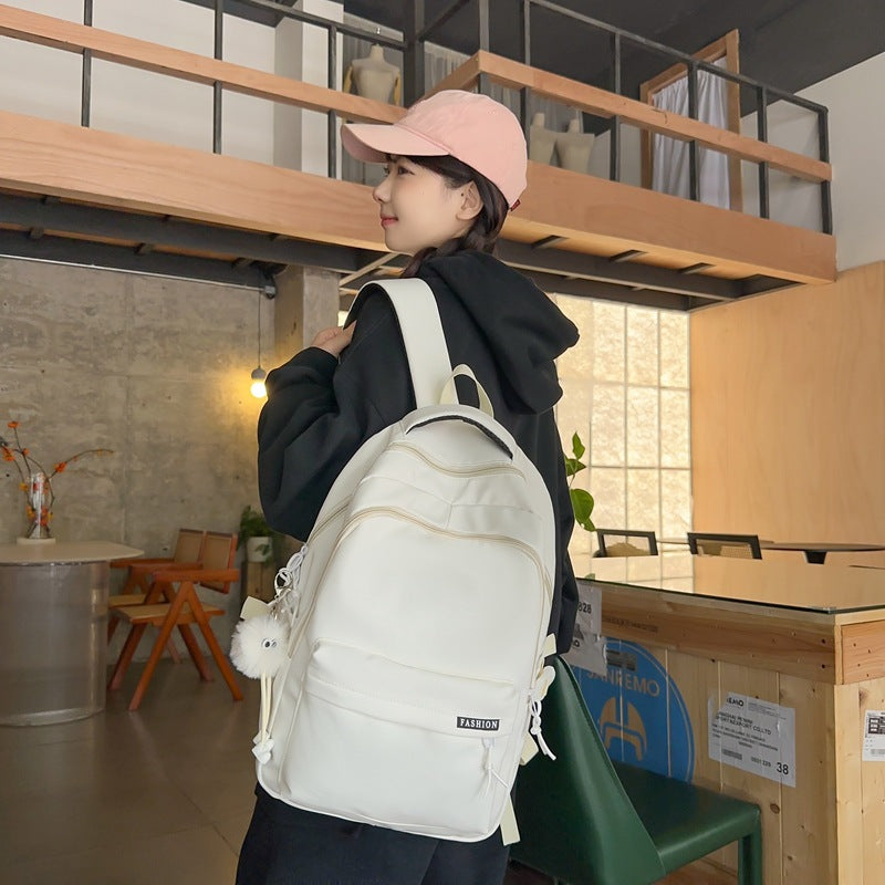 Large capacity burden reduction solid color backpack male junior high school student primary school bag female simple versatile travel backpack