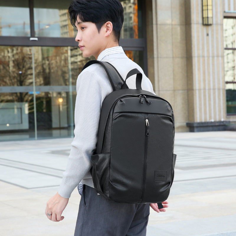 New business Korean version of junior high school students backpack men's large capacity simple PU outdoor travel computer backpack