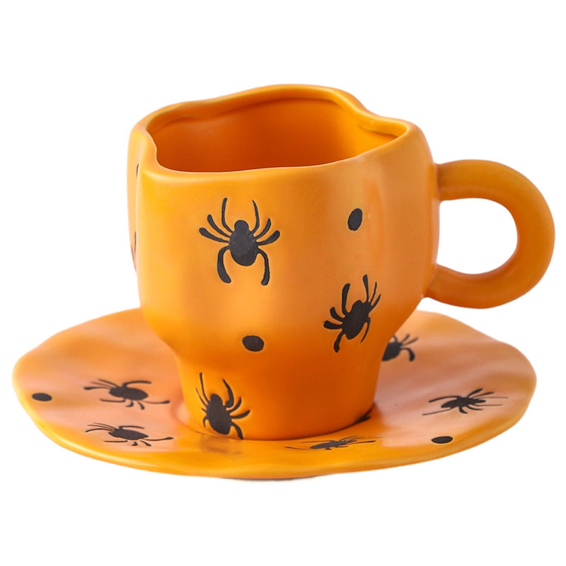 Creative halloween-themed ceramic cup and saucer set, featuring an irregular design with pumpkin and bat motifs. perfect for coffee or tea