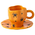 Creative halloween-themed ceramic cup and saucer set, featuring an irregular design with pumpkin and bat motifs. perfect for coffee or tea