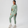 High-waisted, form-fitting yoga pants, a barely-there feel, quick-drying outer layer, and a long-sleeved tee – a women's three-piece activewear set perfect for running and workouts
