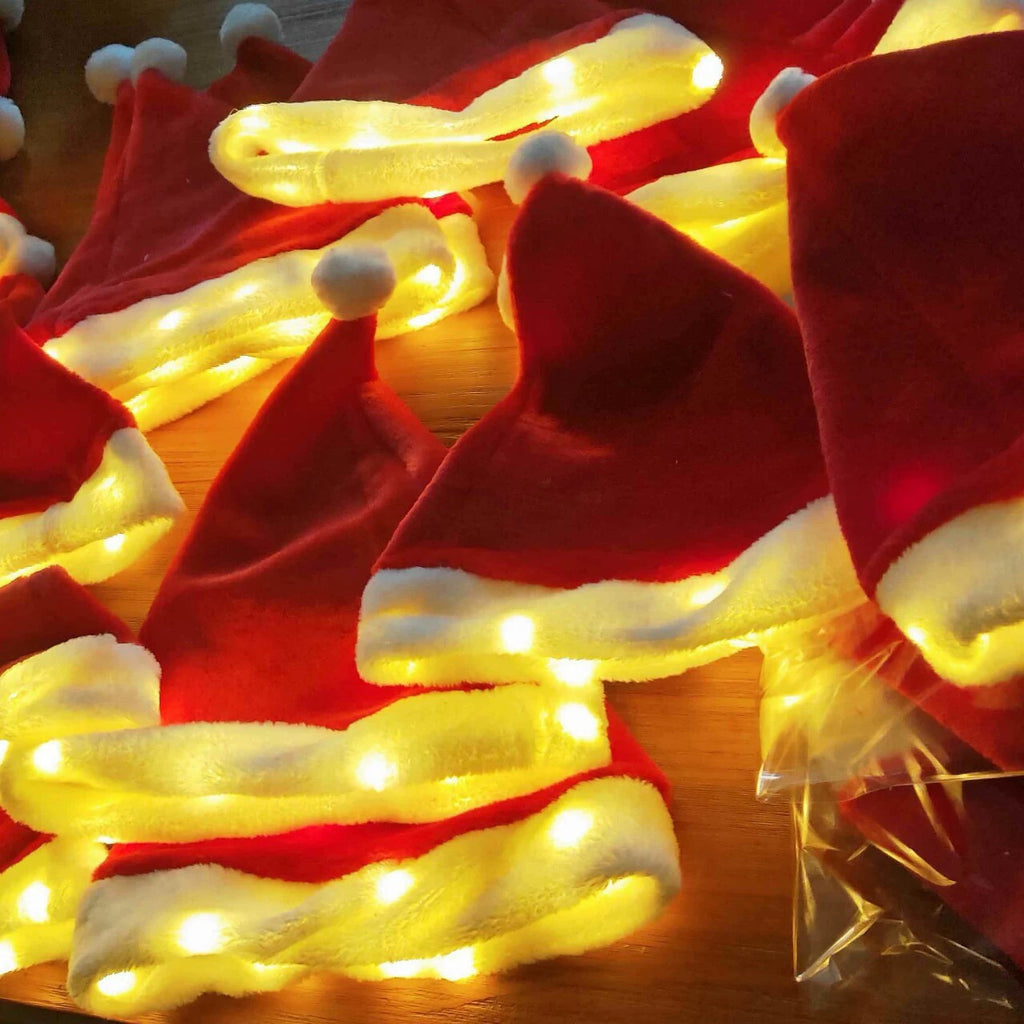 's new glowing Christmas hat, creative LED lights Christmas decoration plush hat lights flashing string headgear