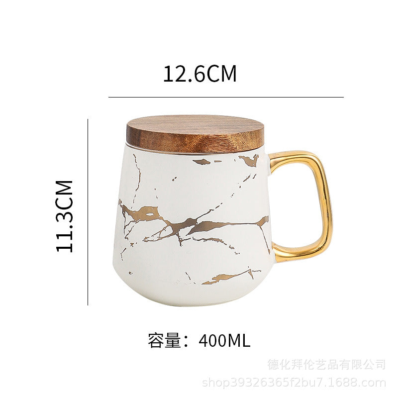 Nordic-inspired ceramic coffee mug, teacup, and saucer set with gold-traced marble pattern and wooden lid