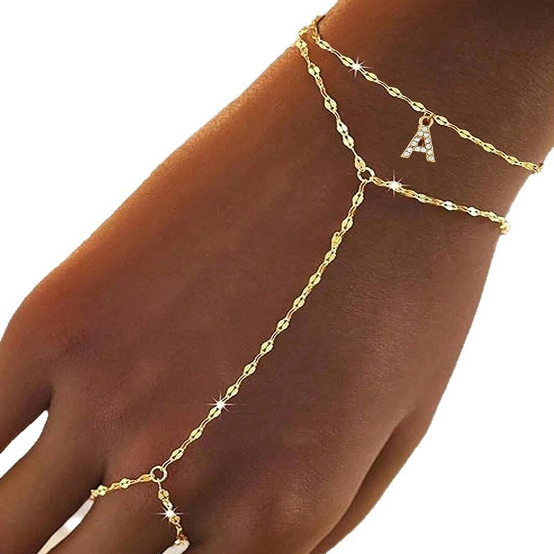 Exquisite new gold-tone chain and trendy ring stainless steel bracelet for women, designed with a chic and individualistic flair