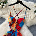 French-inspired, subtly sexy, open-back camisole dress with ruched waist, figure-flattering silhouette, and printed design – perfect for a vacation getaway