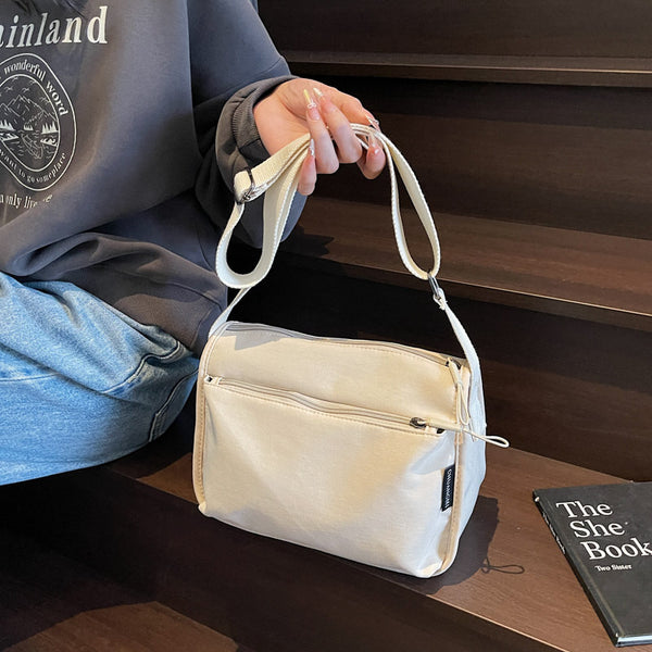 Summer solid color shoulder bag Korean version of fashion versatile messenger bag men and women with the same style convenient multi-pocket storage bag wholesale