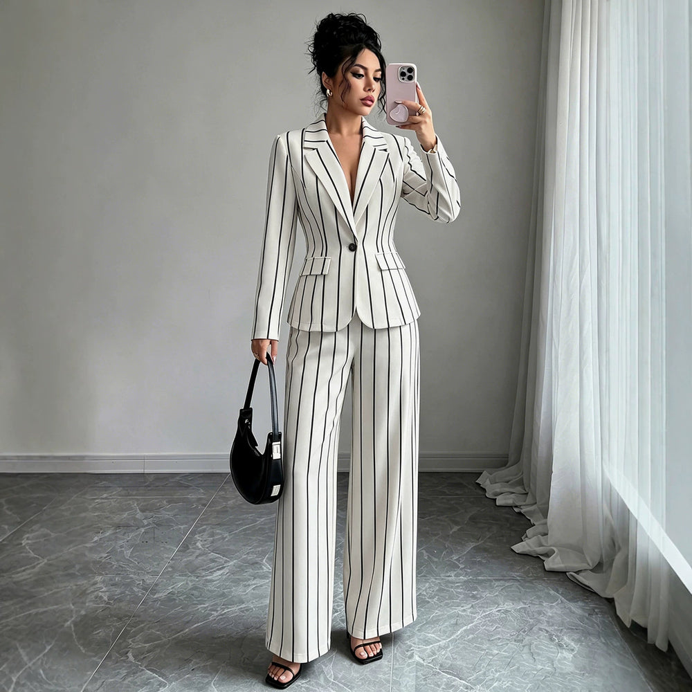 elegant vertical striped commute set: notch lapel blazer with cinched waist, paired with high-waisted, drapey wide-leg trousers for women