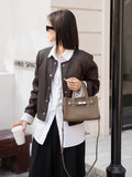 First-layer cowhide niche style design tote bag classy sense 2024fall and winter novice hand-held kelly bag shoulder crossbody bag for women