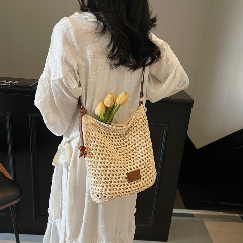 Holiday knitted bag women's 2025 summer new commuter shoulder messenger bag hollow woven bucket bag wholesale