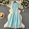 High-end, sophisticated, and feminine two-piece set for women. features a french-style lace crochet blouse with puff sleeves and a high-waisted, slimming midi skirt