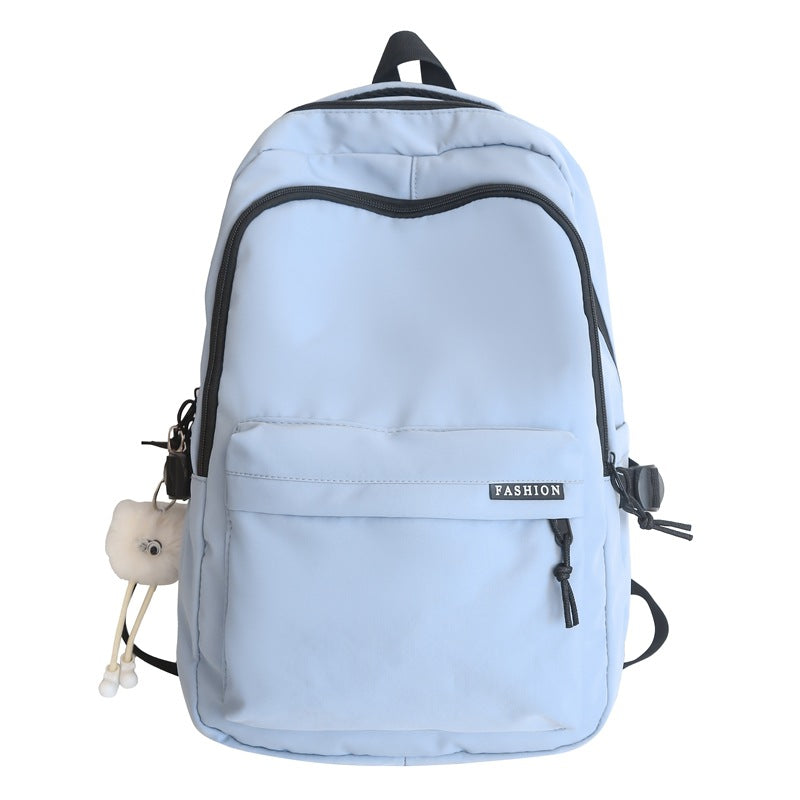 Large capacity burden reduction solid color backpack male junior high school student primary school bag female simple versatile travel backpack