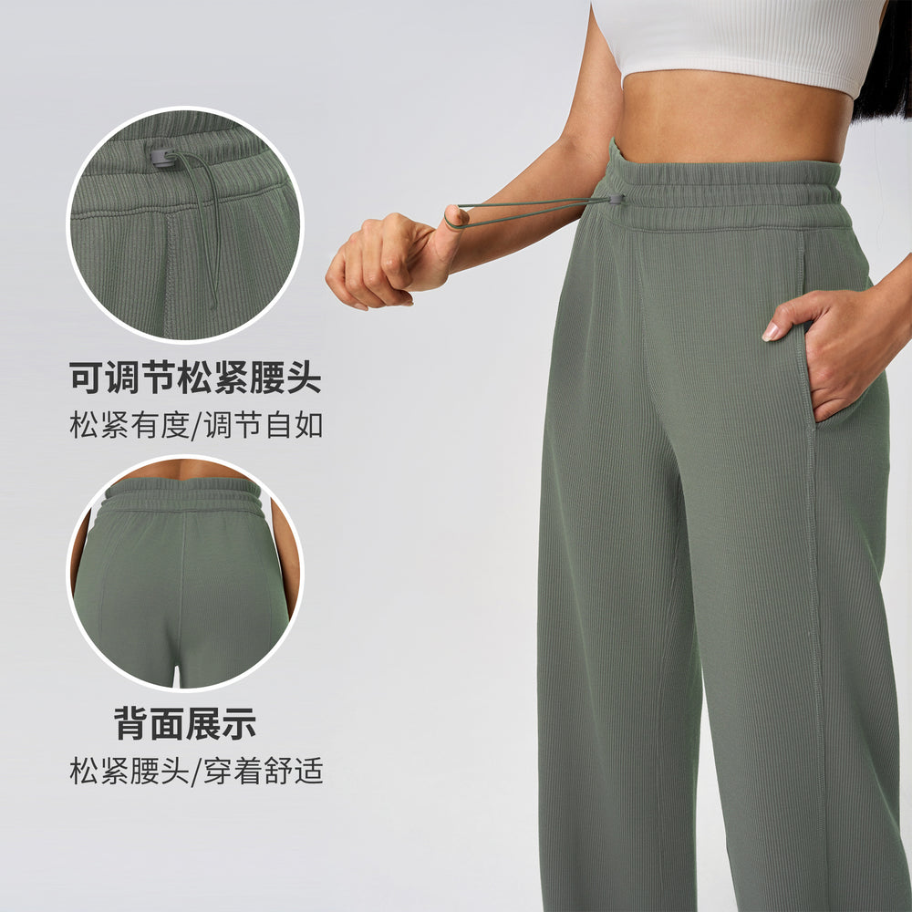 High-waisted, straight-leg pants with a drawstring waistband. versatile and casual, these long pants are designed to elongate the legs with a relaxed, wide-leg fit. perfect for running and workouts. style d25048