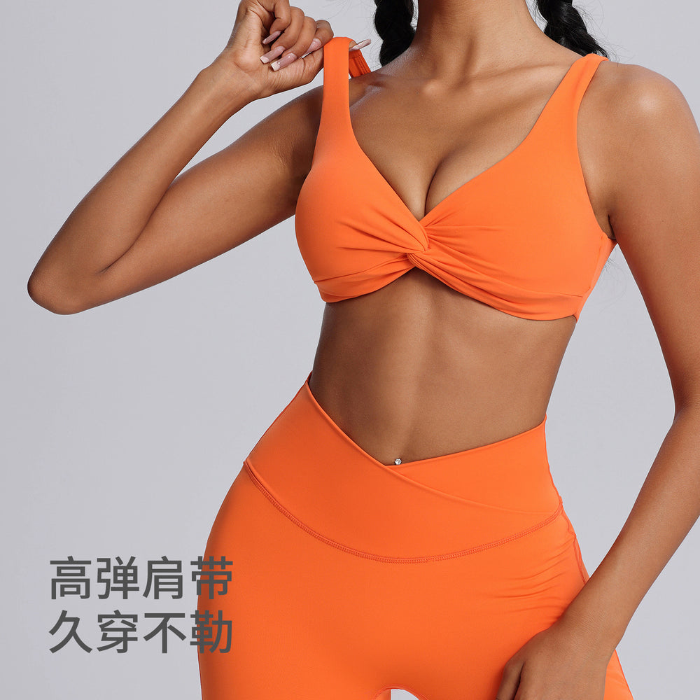 Fashionnew arrivalnude sports intimatesfemale sexy twist shockproof yoga bra beautiful back containing breast pad sports bra