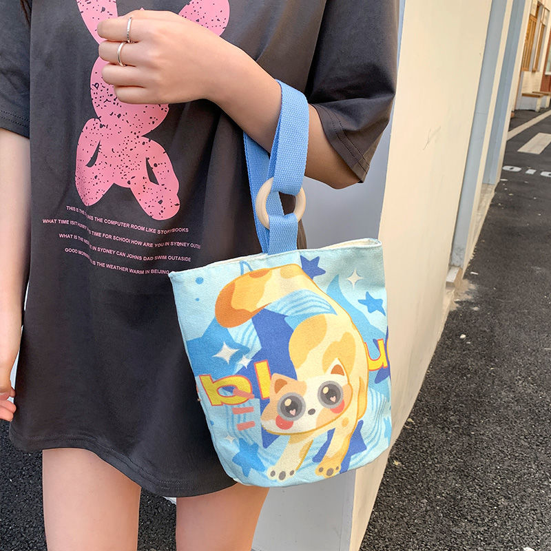 Cute cartoon canvas tote bag for women, 2024 new style handheld bucket bag, large capacity lunch bag, fashionable cloth handbag